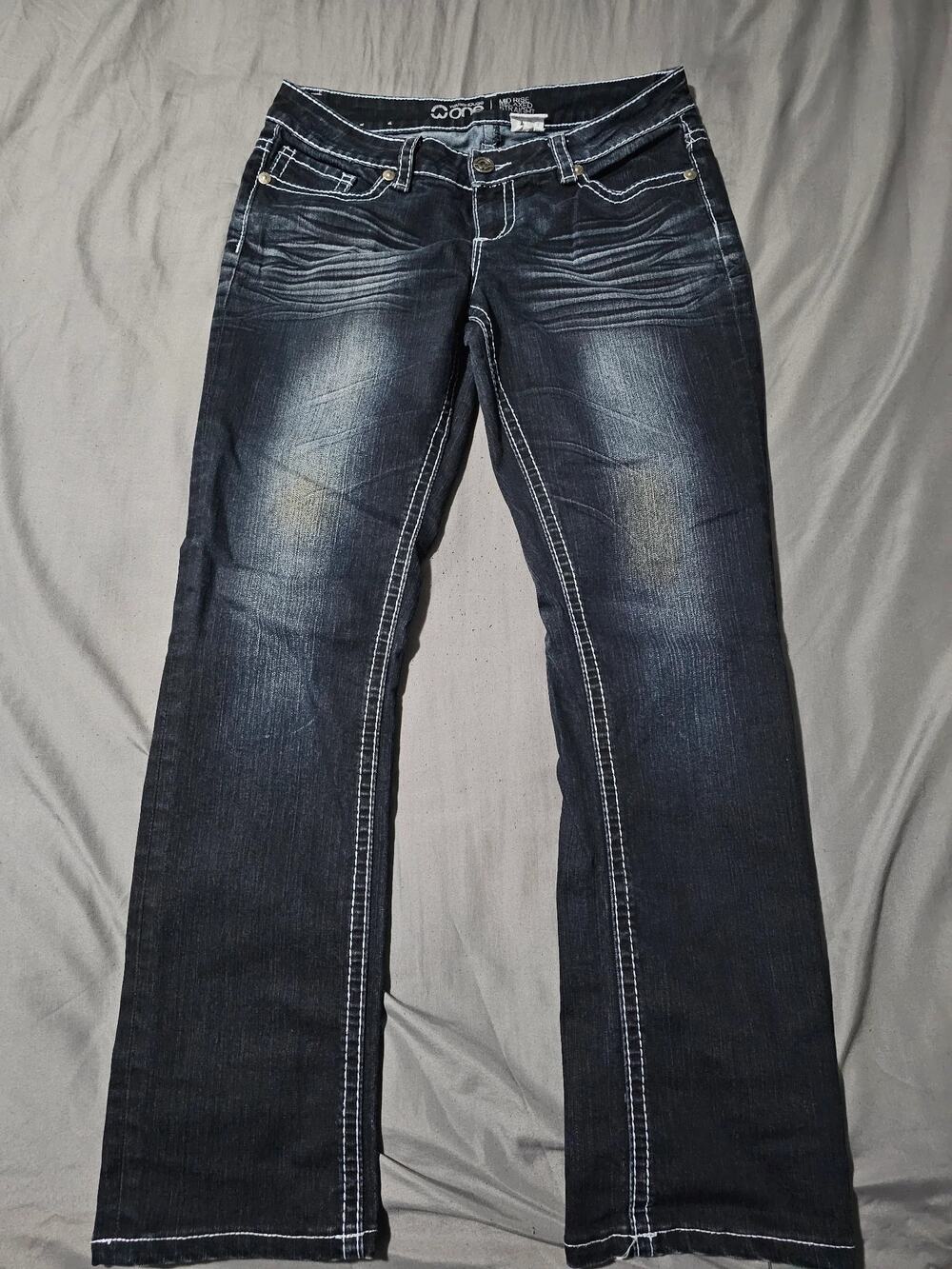Dark wash bootcut jeans contrast stitching embroidered back pockets zip fly